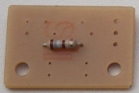 First, insert and solder R1, which is 180\_ohms, so it's color-coded **brown-grey-brown**.